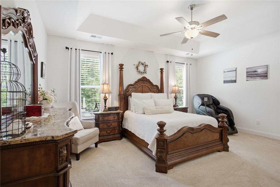 Image 3: This spacious bedroom offers a tranquil retreat wi