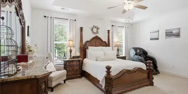 Image 3: This spacious bedroom offers a tranquil retreat wi