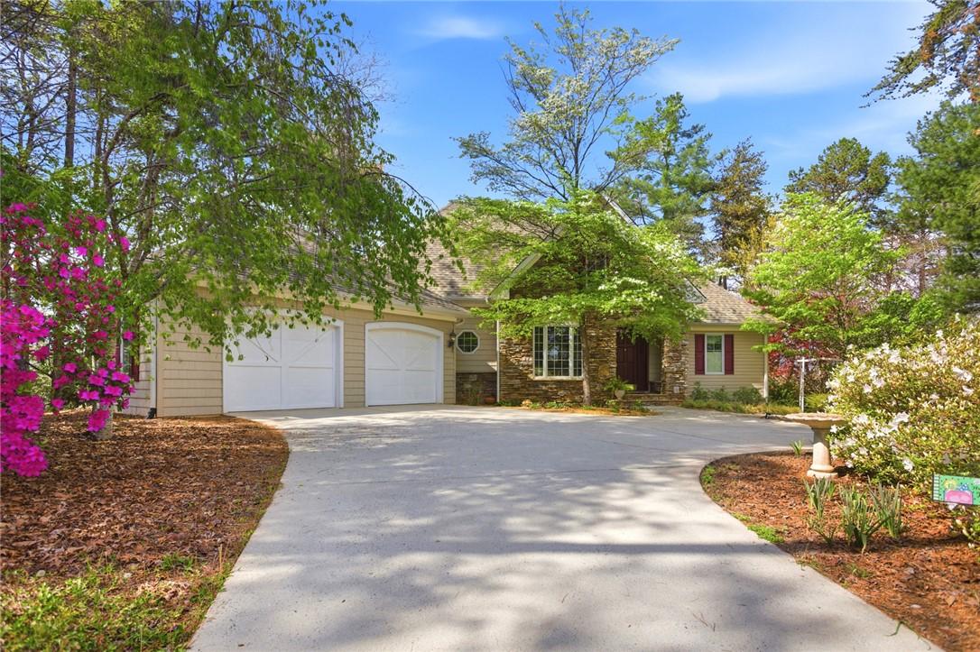 Image 4: This residence features a charming exterior with a
