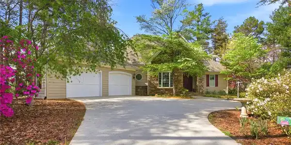 Image 4: This residence features a charming exterior with a