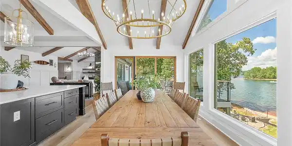 Image 3: Soaring beamed ceilings and expansive lakeside win