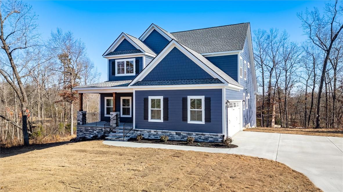 Image 2: This charming home offers a welcoming facade with