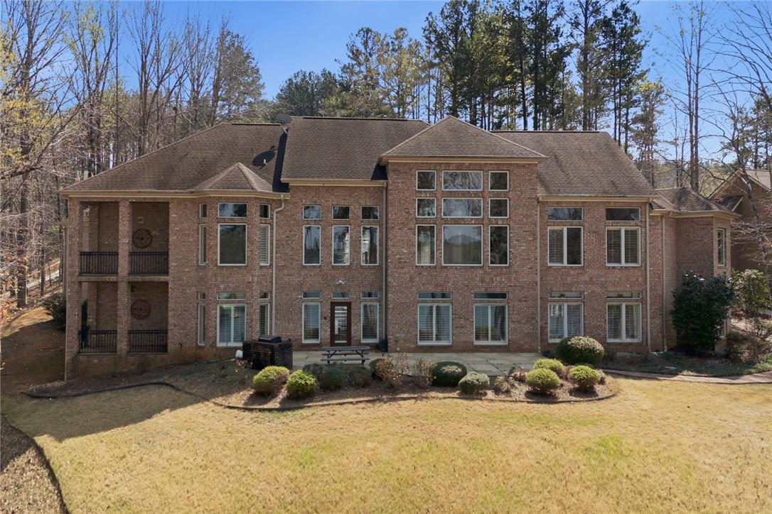 Image 2: This expansive brick residence offers ample space