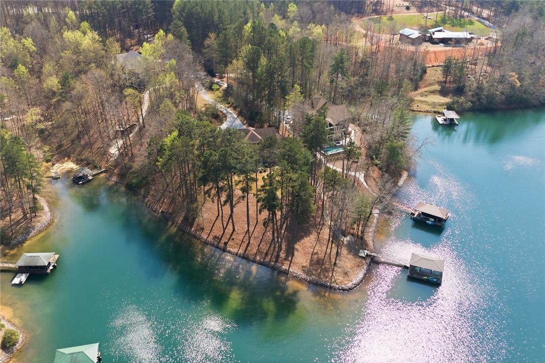 Image 4: This aerial view showcases a tranquil Lake Keowee
