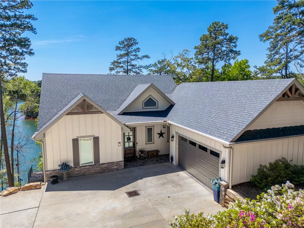 Image 2: This charming lakeside residence features a classi
