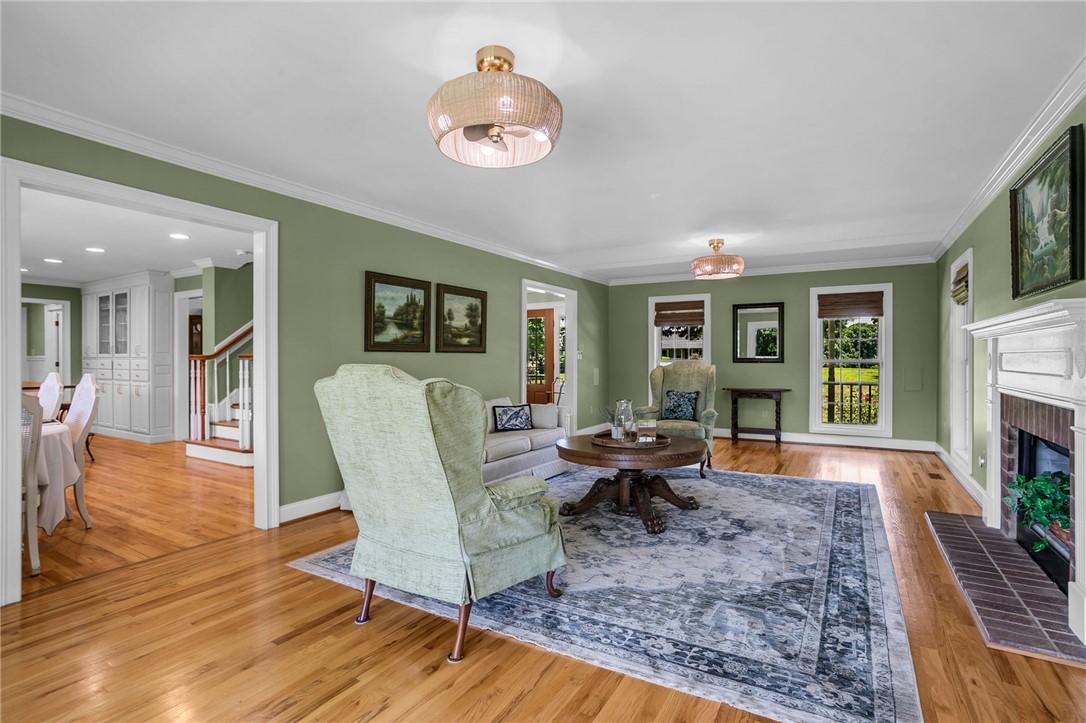 Image 4: Hardwood floors flow through this welcoming living