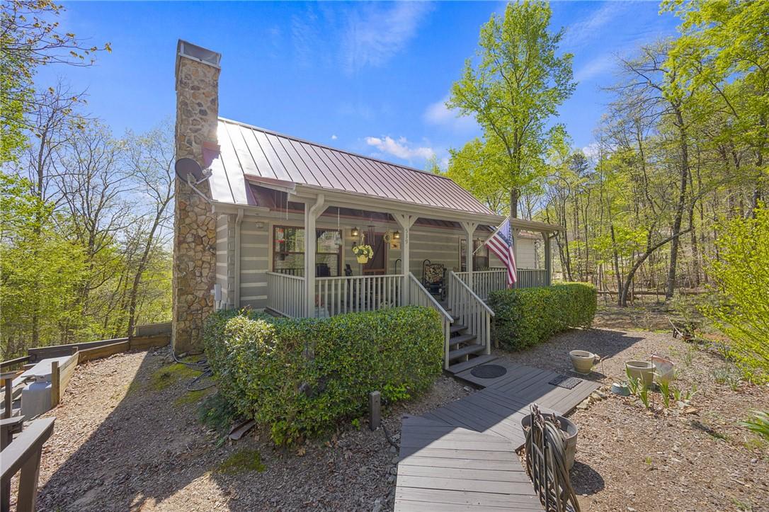 Image 1: Charming cabin nestled in a serene woodland settin