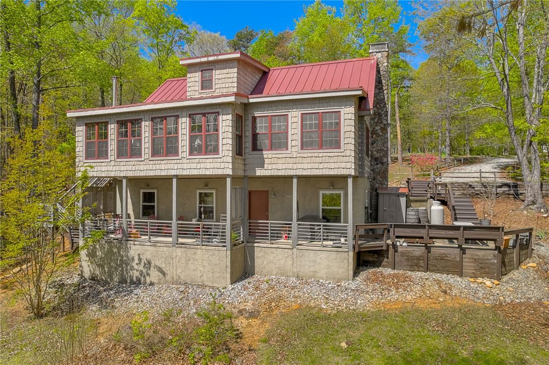 Image 2: This elevated home offers panoramic views and peac