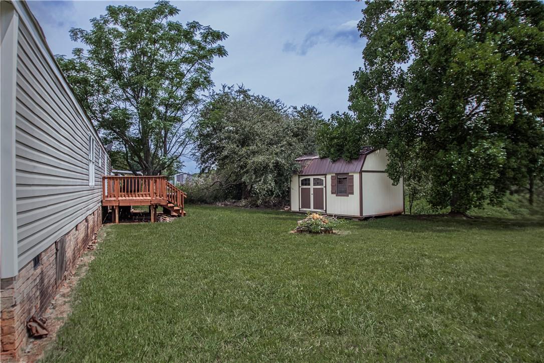 Image 4: A spacious yard provides ample room for activities
