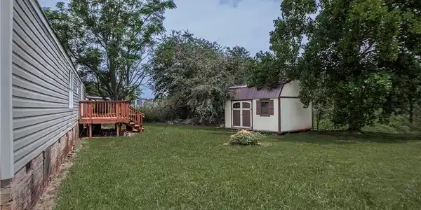 Image 4: A spacious yard provides ample room for activities