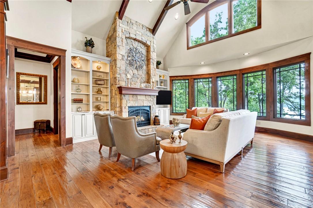Image 4: Vast windows illuminate this inviting living space