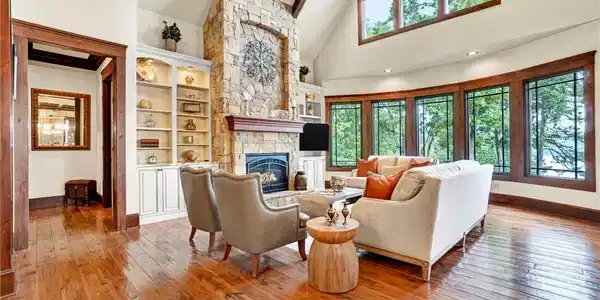 Image 4: Vast windows illuminate this inviting living space