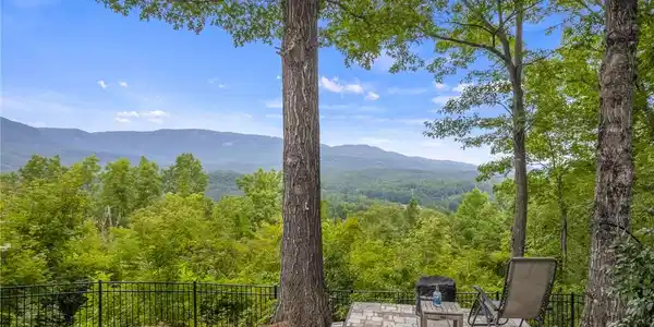 Image 3: A secluded patio offers sweeping mountain vistas a