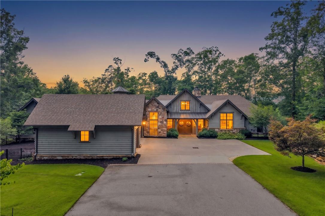 Image 2: A grand rustic estate beckons with warm illuminate