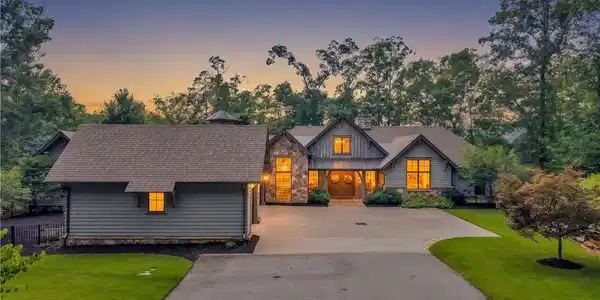 Image 2: A grand rustic estate beckons with warm illuminate