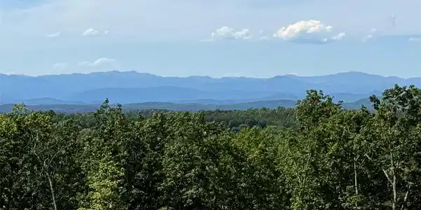 Image 2: Panoramic mountain views provide a serene backdrop
