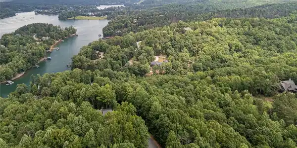 Image 3: An aerial perspective reveals a serene lakefront c
