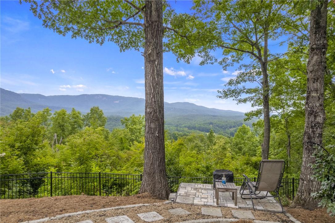 Image 3: A secluded patio offers sweeping mountain vistas a
