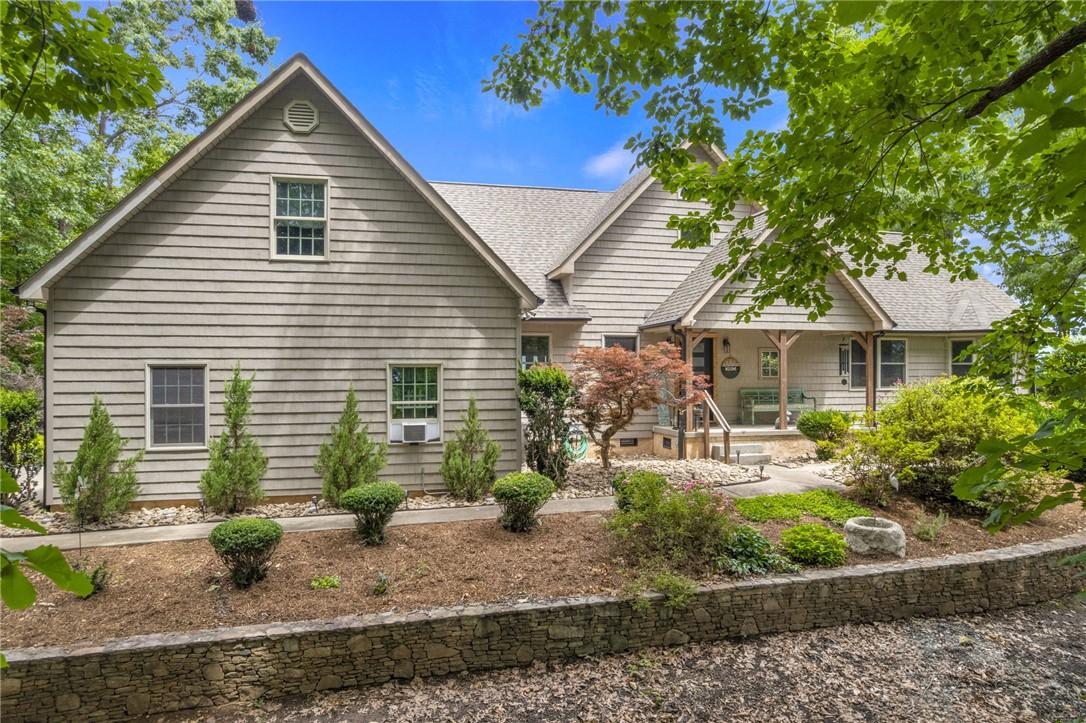 Image 4: A welcoming front porch and well-maintained landsc