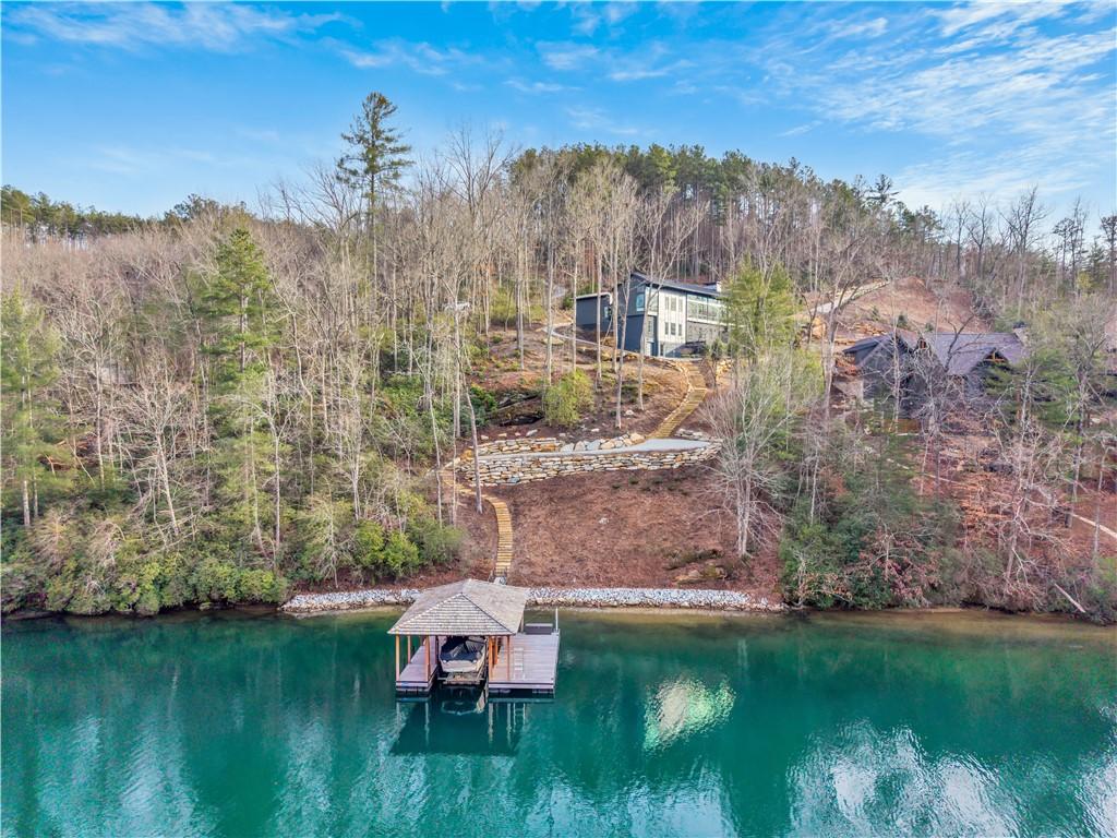 Image 2: This serene lakefront residence offers direct wate