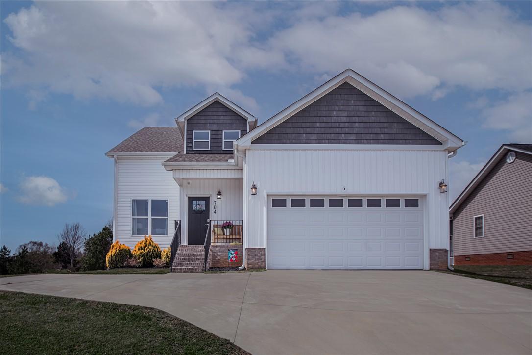 Image 1: This charming residence features a well-maintained