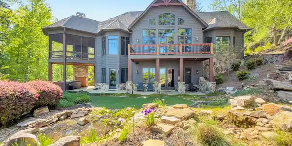 Image 2: This spacious house offers multiple outdoor areas