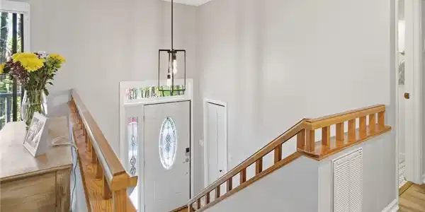 Image 3: This entry offers a bright welcome with classic ar