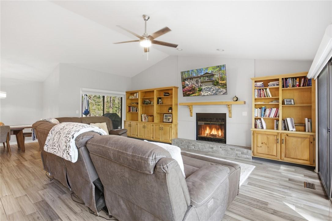 Image 4: This inviting living space features vaulted ceilin