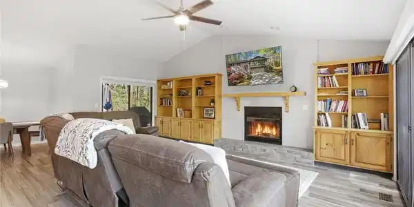 Image 4: This inviting living space features vaulted ceilin