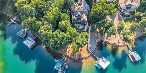 Image 2: Mature trees frame a private lakeside retreat comp