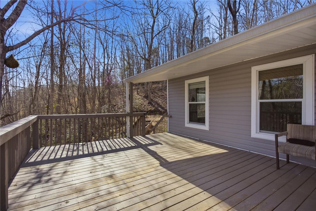 Image 3: Enjoy tranquil woodland views from this inviting o