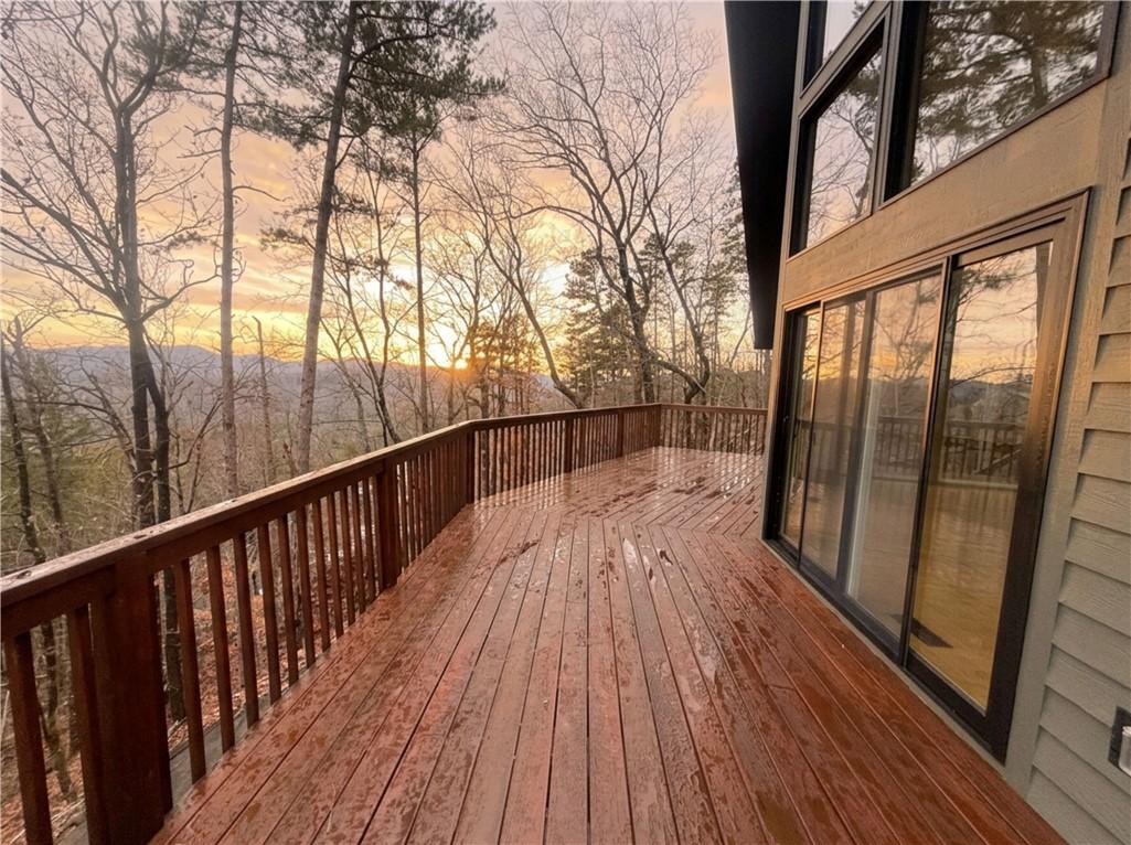 Image 3: An inviting deck offers serene mountain vistas and