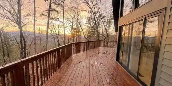 Image 3: An inviting deck offers serene mountain vistas and