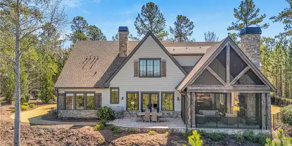 Image 2: This beautiful residence features a screened porch