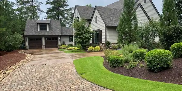Image 3: This charming residence features a well-manicured