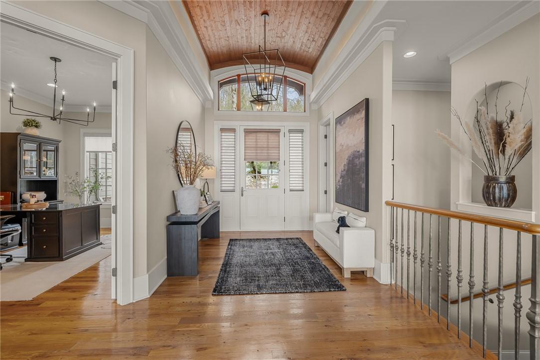 Image 2: Enter into a welcoming foyer boasting natural ligh