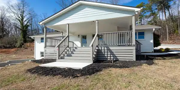 Image 2: This charming home offers a welcoming facade with