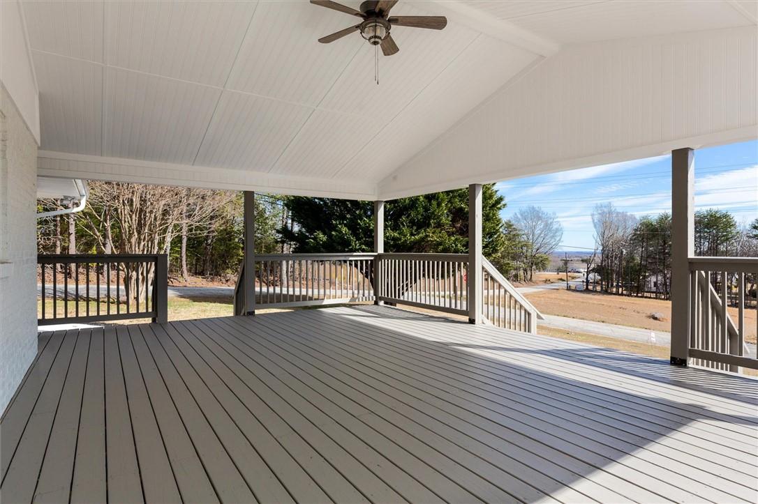 Image 3: An inviting covered patio offers ample space for o