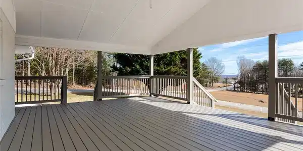 Image 3: An inviting covered patio offers ample space for o