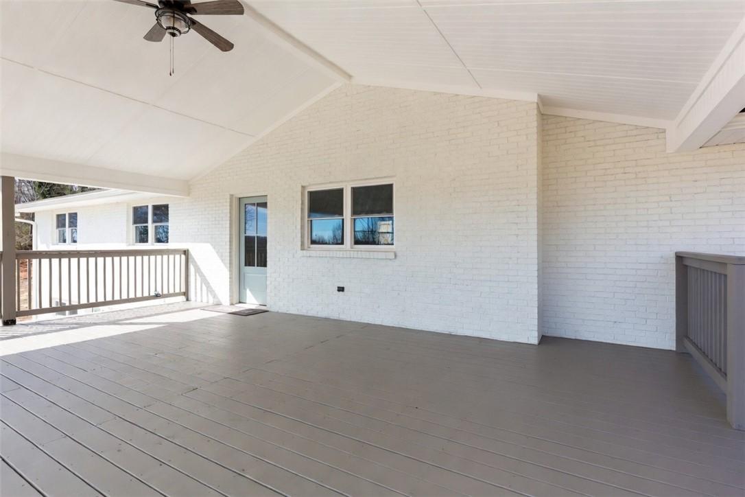 Image 4: This spacious covered patio offers ample outdoor l