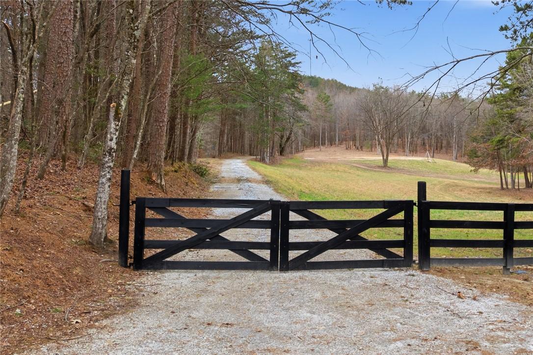 Image 1: This scenic rural property boasts a charming woode