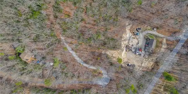 Image 2: This elevated view captures a secluded property ne