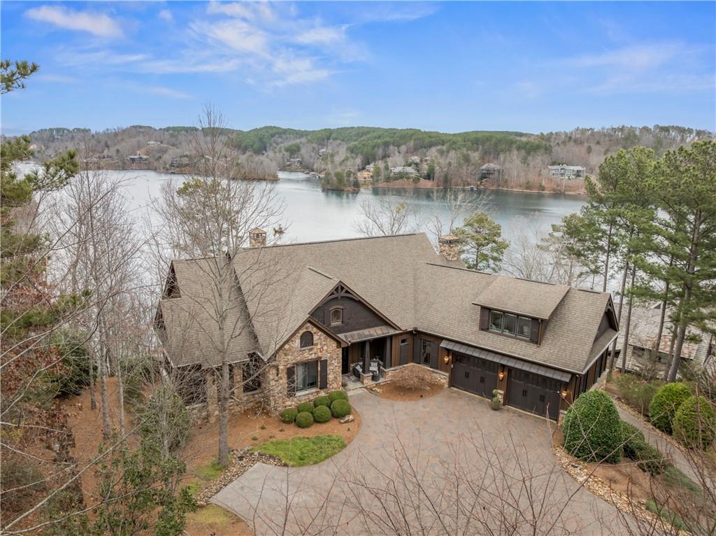 Image 1: This lakefront home offers a tranquil escape with