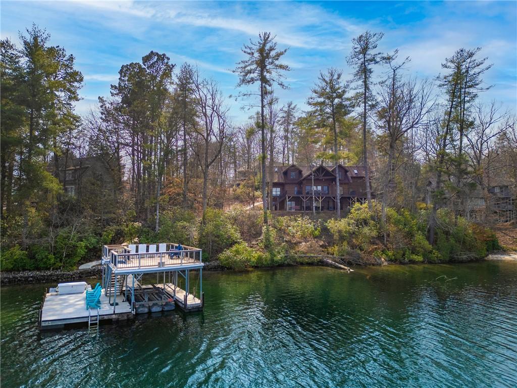 Image 2: This charming lakeside home features a private doc