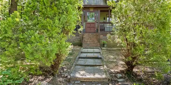 Image 3: This charming home offers a welcoming entrance sur