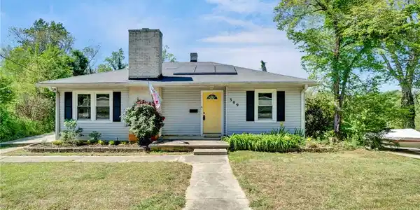 Image 2: This charming residence features a well-maintained