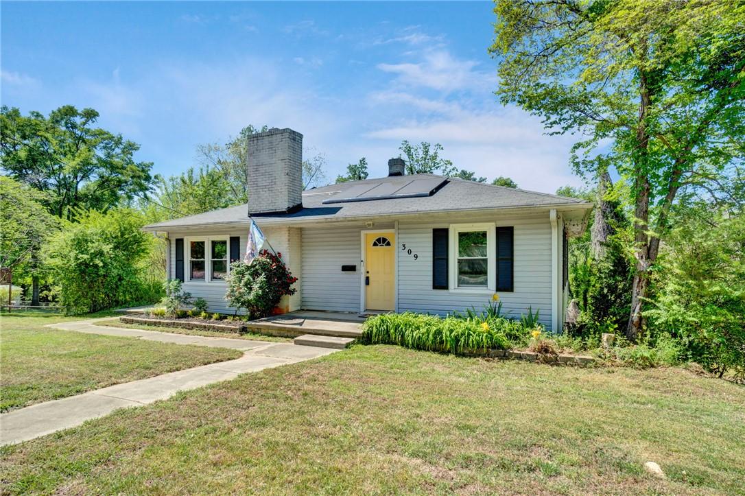 Image 3: This charming residence features a well-maintained