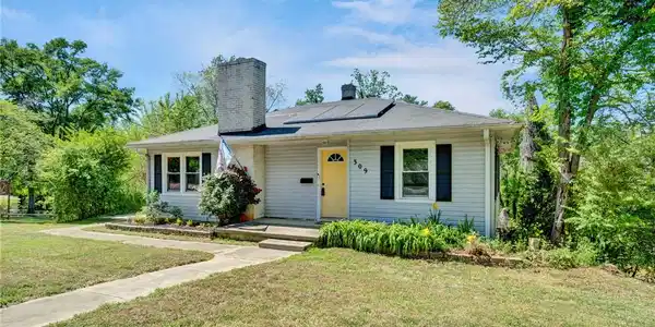 Image 3: This charming residence features a well-maintained