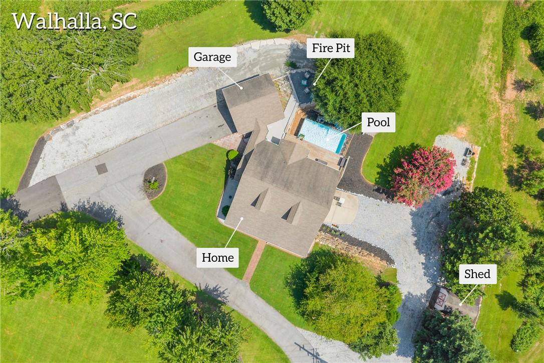Image 3: An aerial view reveals a spacious home with an inv