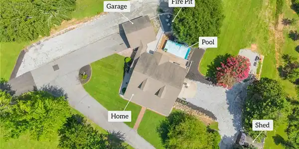 Image 3: An aerial view reveals a spacious home with an inv